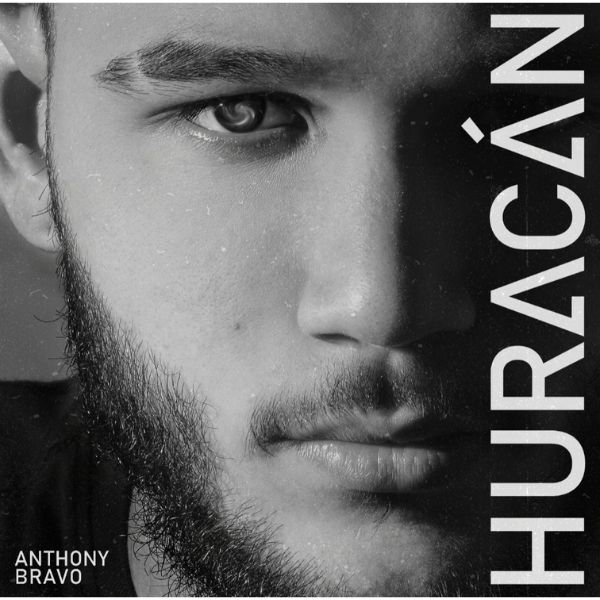 A concert crowd with hands in the air